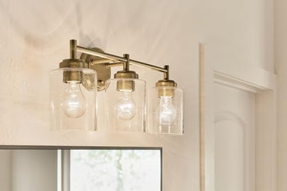 Kichler Winslow 3-Light Farmhouse Vanity Light, Natural Brass | Clear seeded glass vanity light with industrial styling (21.5" x 9.25"), 45886NBR - color: Natural Brass, size: 21.5"