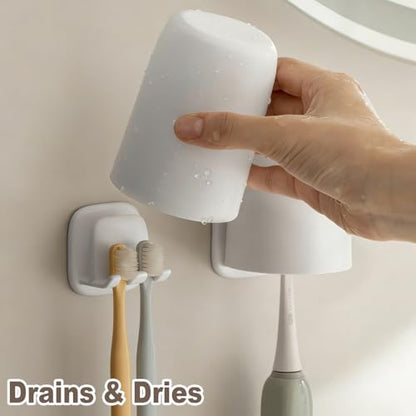 2PCS Wall Mounted Toothbrush Holder, Adhesive 2-Slot Toothbrush Organizer with Cup Hook No-Drill Bathroom Organizer for Toothbrushes, Mouthwash Cup - Self-Sticky Seamless Storage Rack (White)