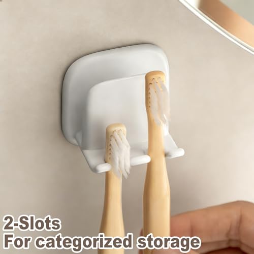 2PCS Wall Mounted Toothbrush Holder, Adhesive 2-Slot Toothbrush Organizer with Cup Hook No-Drill Bathroom Organizer for Toothbrushes, Mouthwash Cup - Self-Sticky Seamless Storage Rack (White)