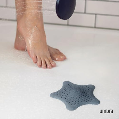Umbra Starfish Hair Catcher, Suction Cup Drain Cover, 6-Inch, Slate Blue | Silicone material, flexible and durable, water resistant seal, easy to clean, rust proof, fits standard tubs - color: Slate Blue