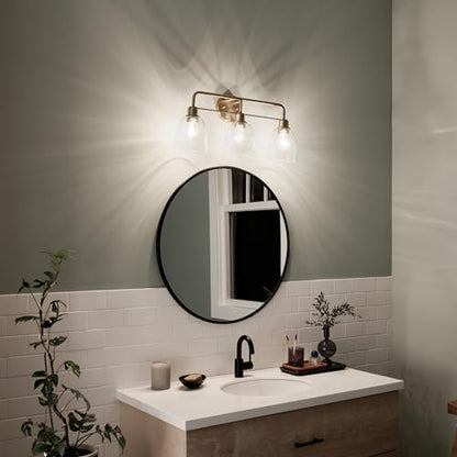 Kichler Meller 24.25" 3-Light Bathroom Vanity Light Fixture with Clear Glass Shades in Champagne Bronze for Mirror or Powder Room (24.25" W x 11.25" H x 7" D) 55102CPZ - color: Champagne Bronze, style: 3 Light