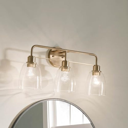 Kichler Meller 24.25" 3-Light Bathroom Vanity Light Fixture with Clear Glass Shades in Champagne Bronze for Mirror or Powder Room (24.25" W x 11.25" H x 7" D) 55102CPZ - color: Champagne Bronze, style: 3 Light